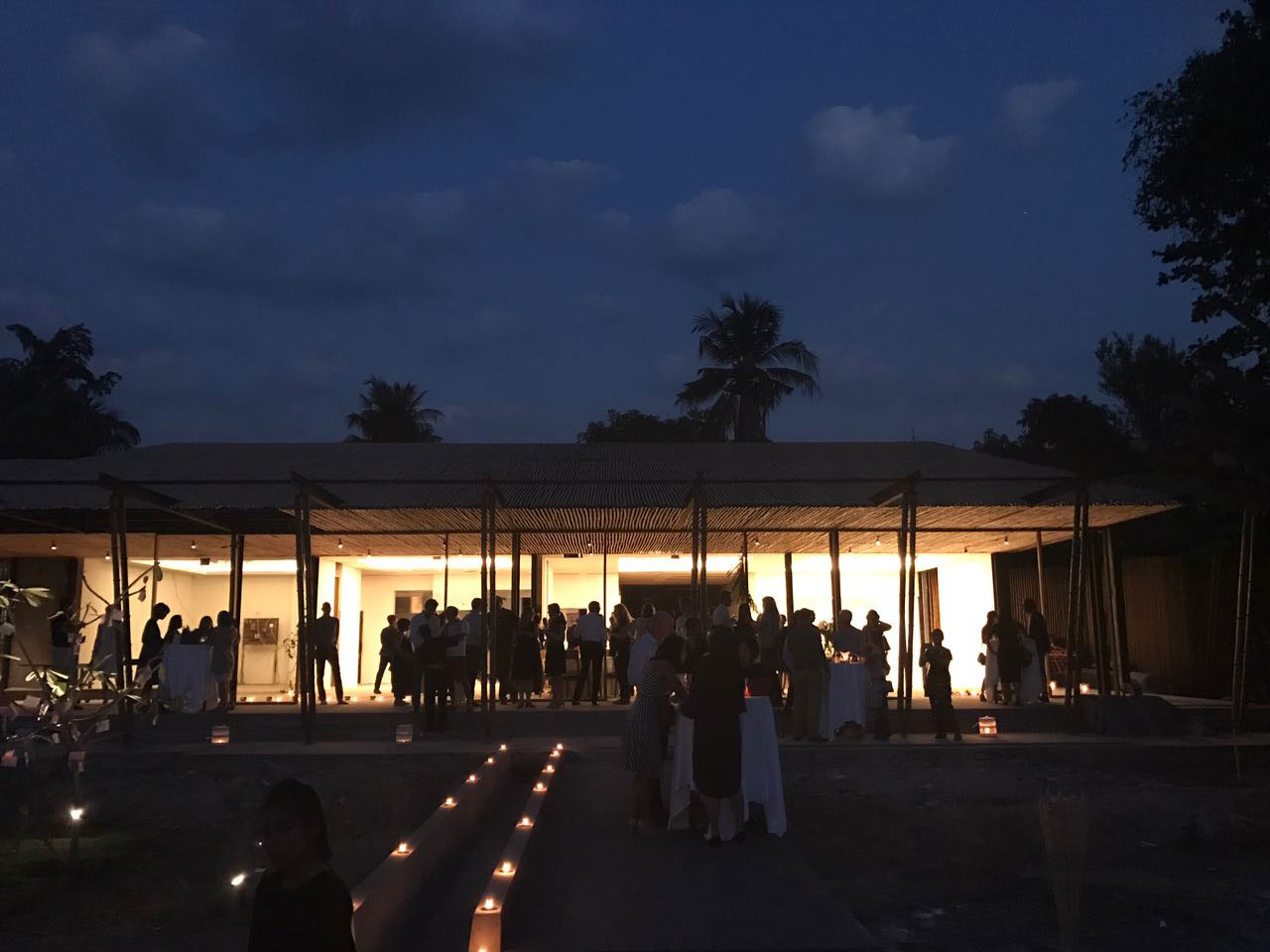 Guests celebrating the last stage of construction within the empty structure of SEEDS property.